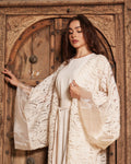 luxurious off-white abaya with a flowing silhouette and delicate embroidery